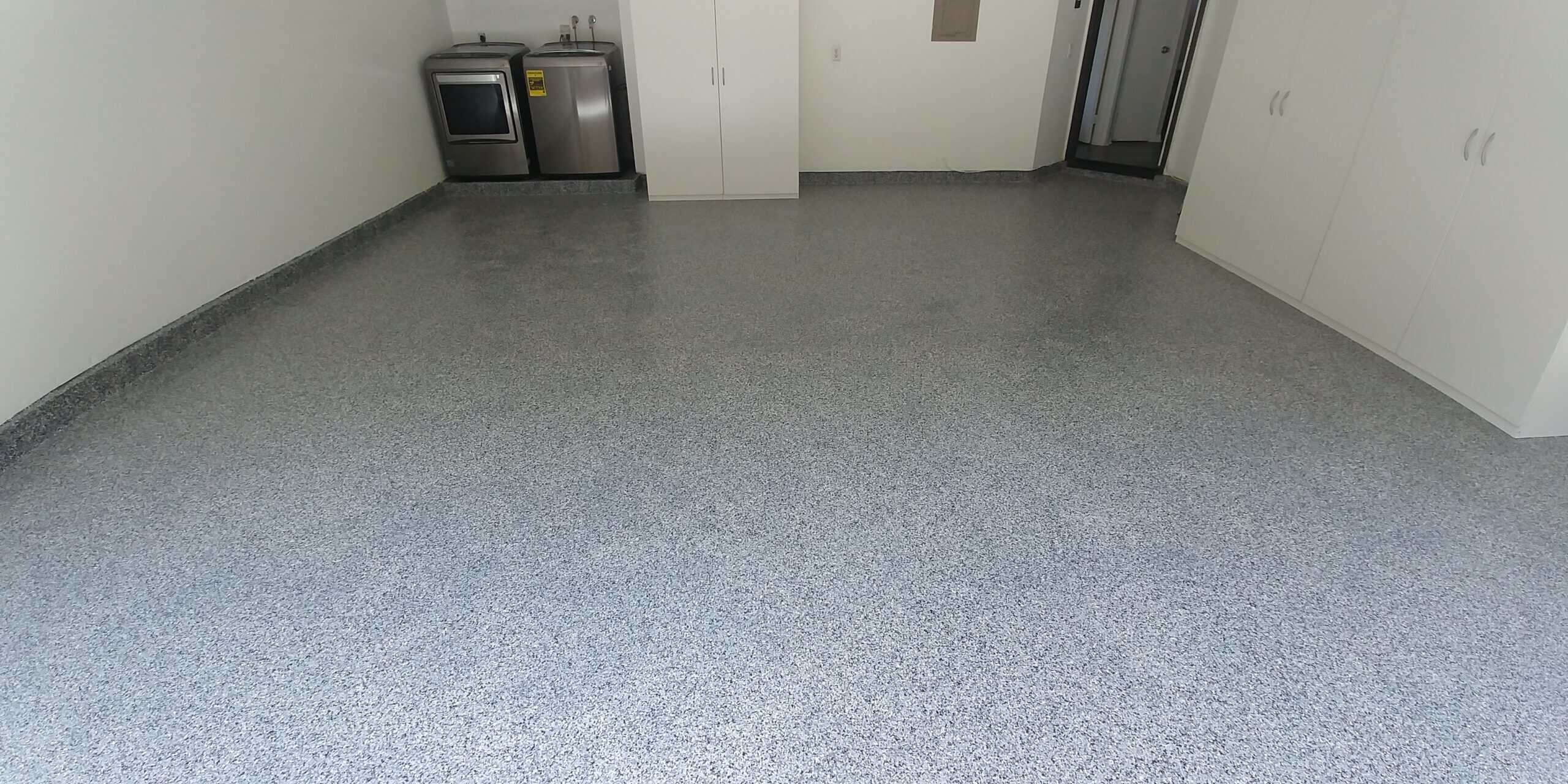 Gray flake epoxy floor in a finished residential garage