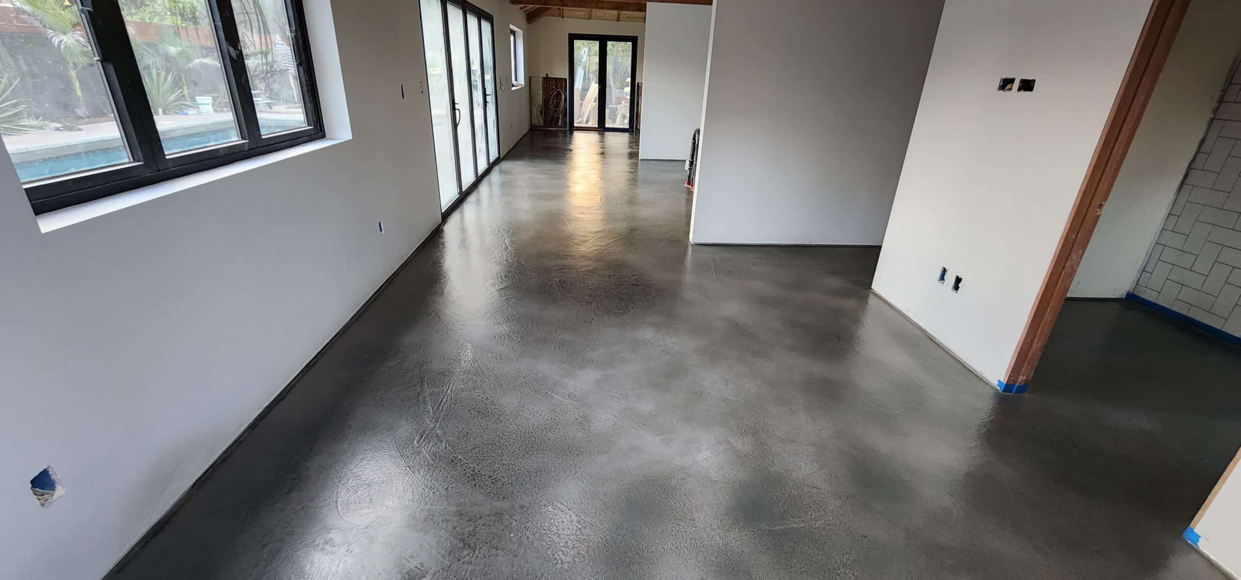 Smooth charcoal micro-topping overlay in a bright modern living space