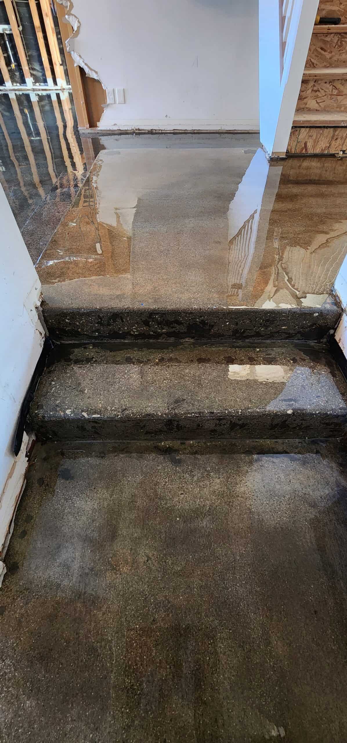 Self-levelling overlay being poured over a concrete floor