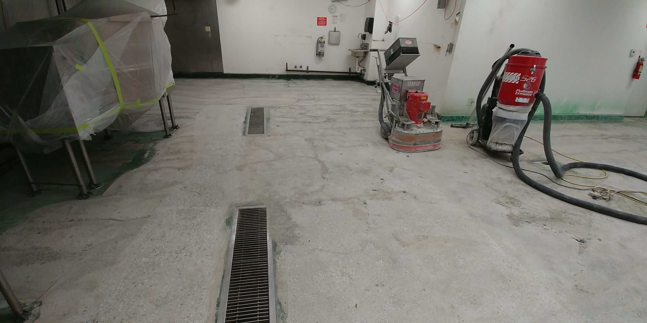 Epoxy coating being applied to a prepared commercial floor