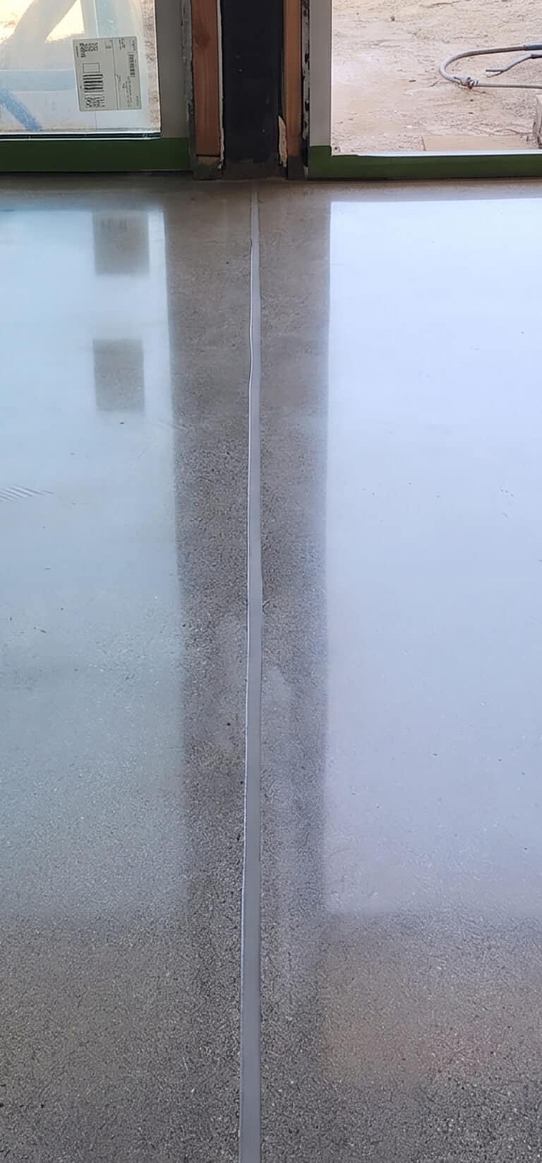 Concrete control joint after filling, ground flush with the floor