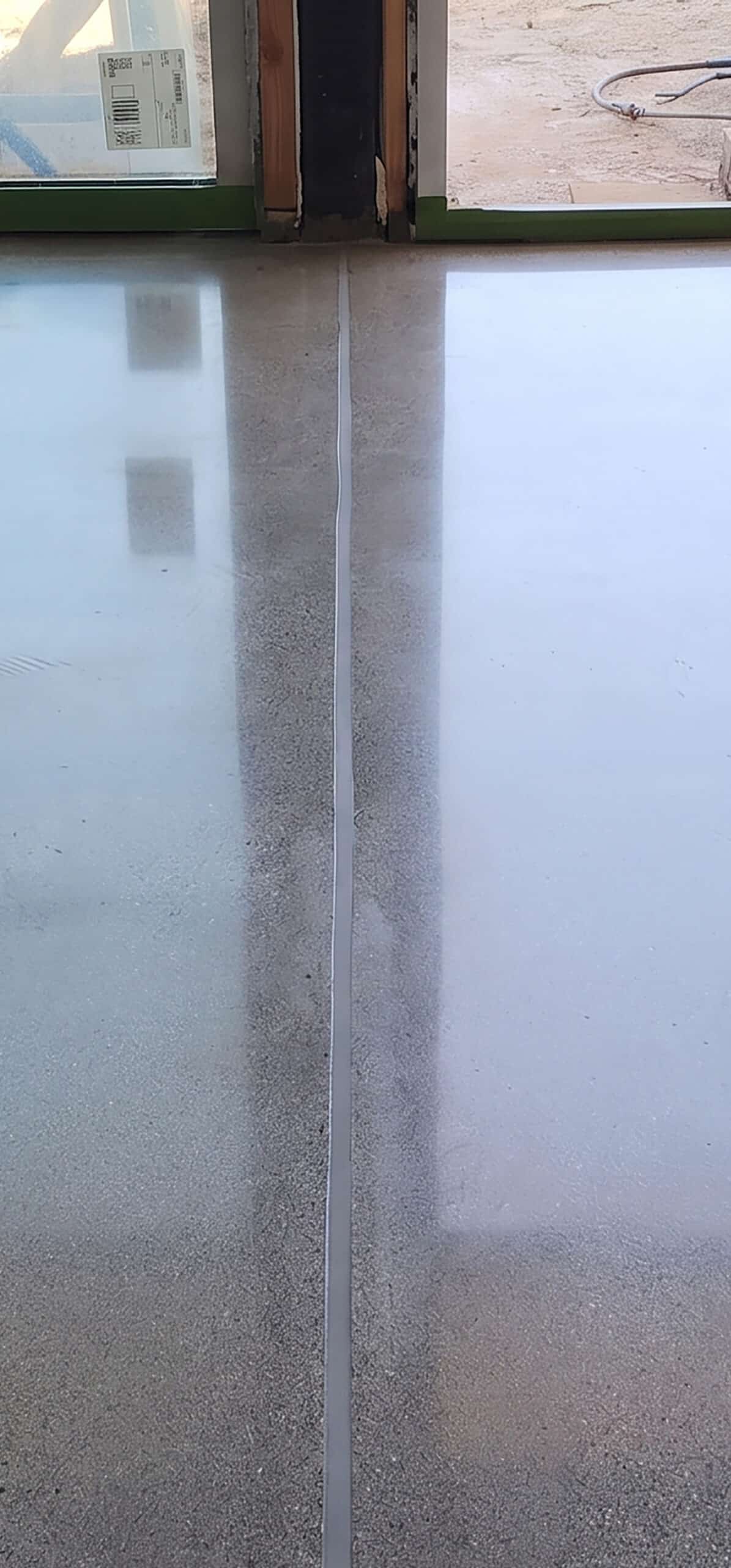 Concrete control joint after filling, ground flush with the floor