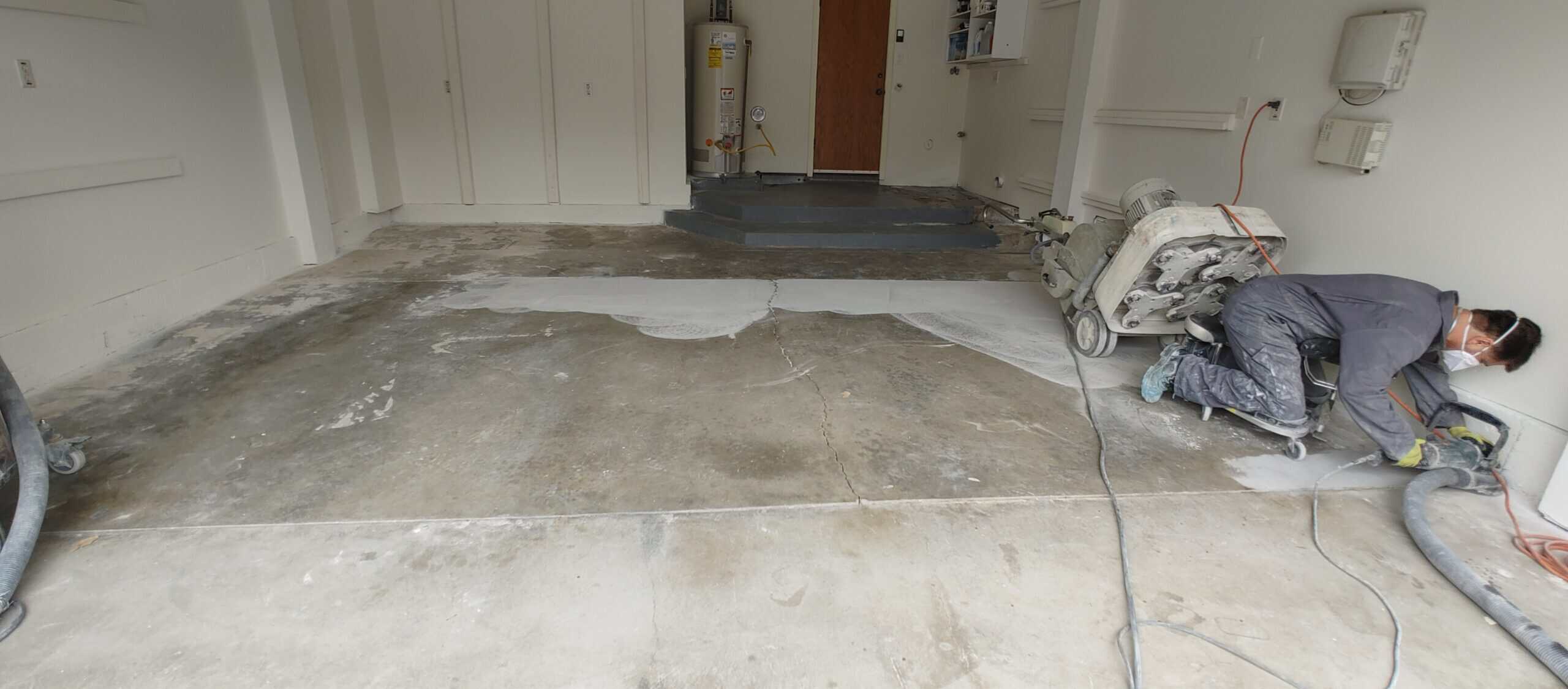 Epoxy coating being applied to a prepared garage floor