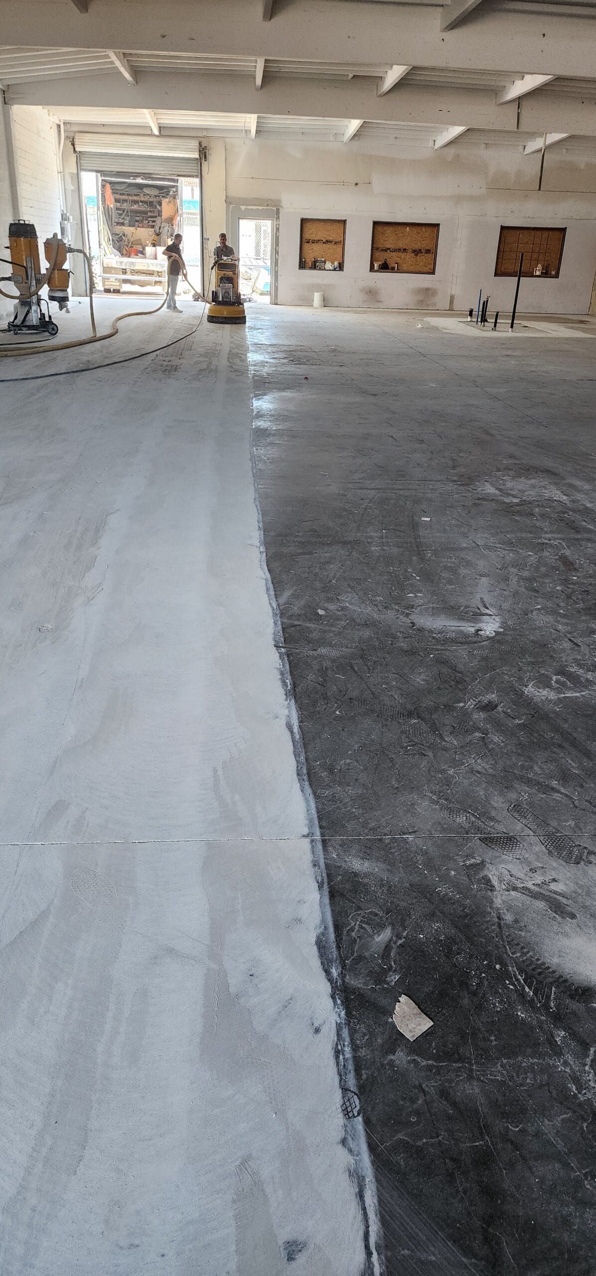 Commercial concrete being ground back ahead of sealing