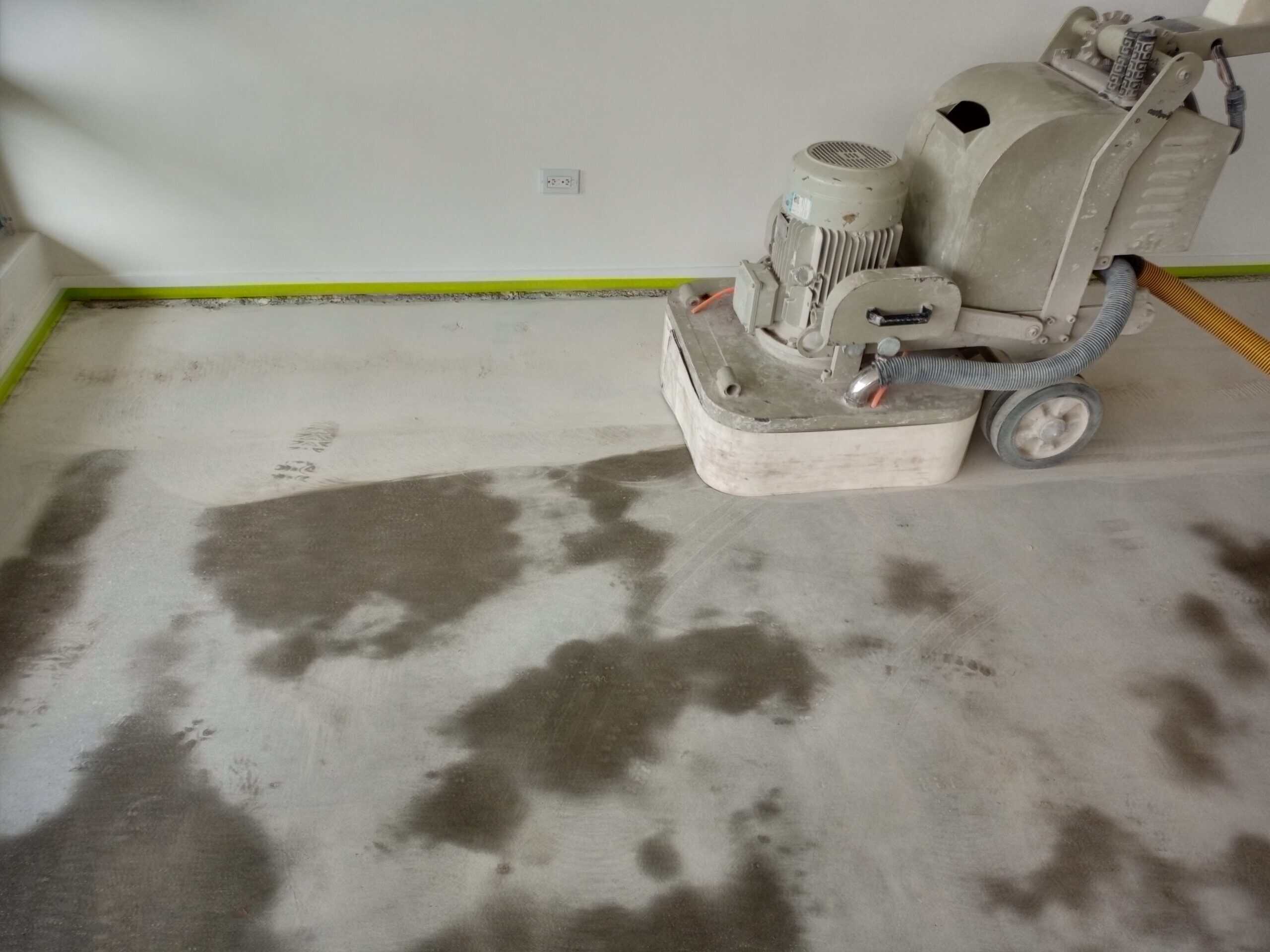Residential concrete being ground back ahead of sealing