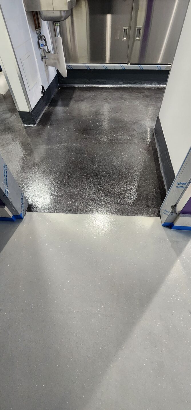 Finished retail floor reflecting the ceiling lights