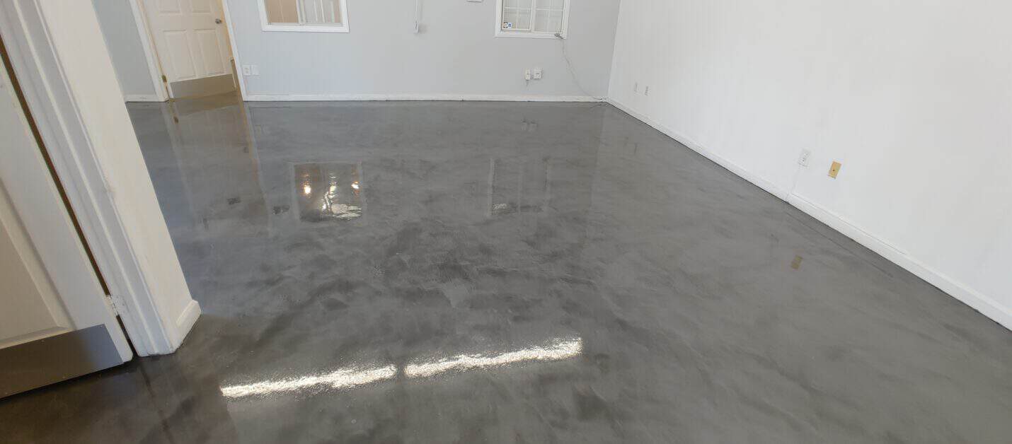 Metallic epoxy floor in the office restroom