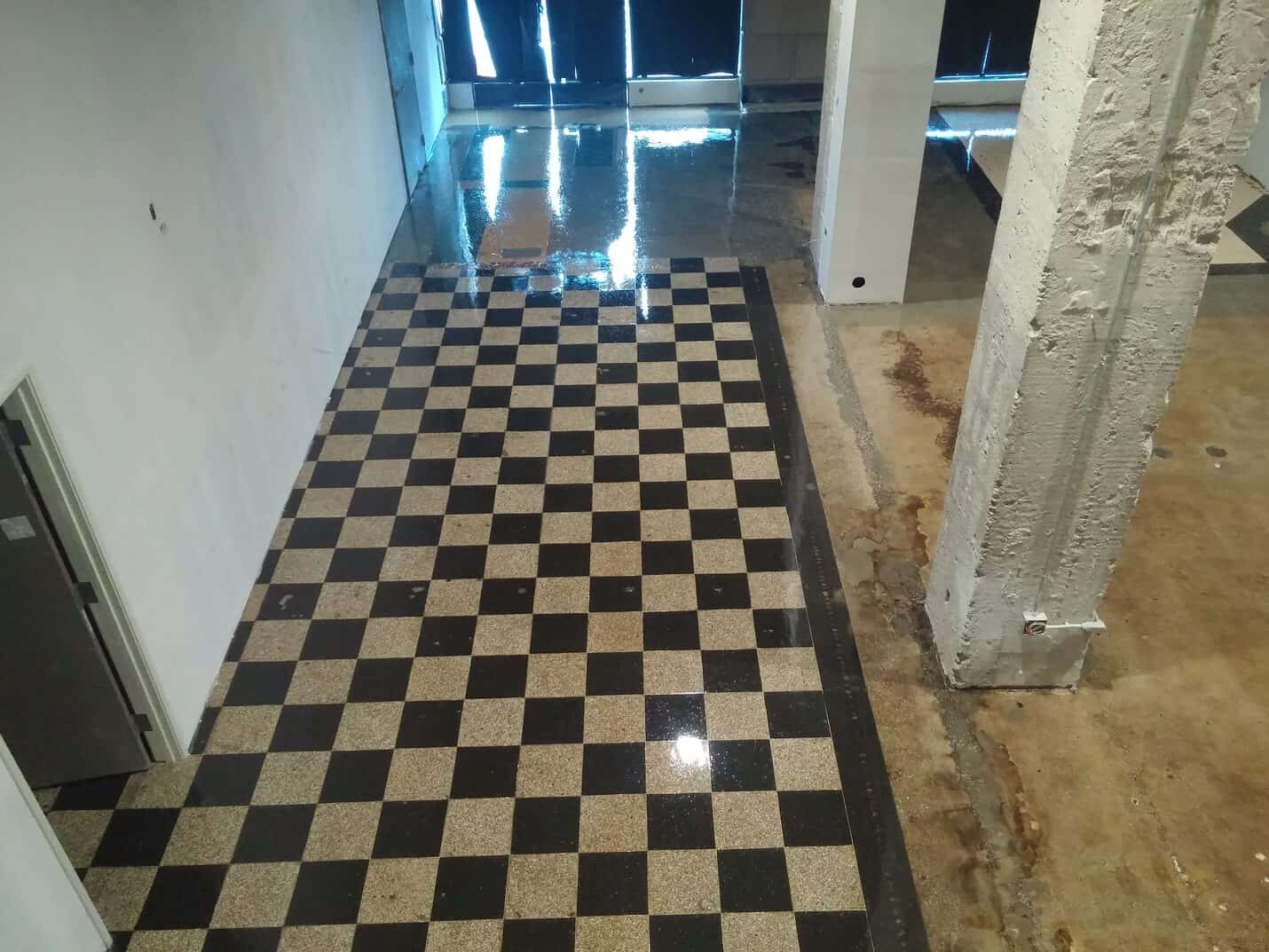 Clear coated checkerboard running through the building circulation