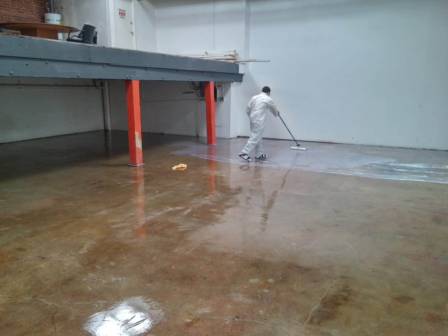 Matte clear epoxy floor under the steel mezzanine