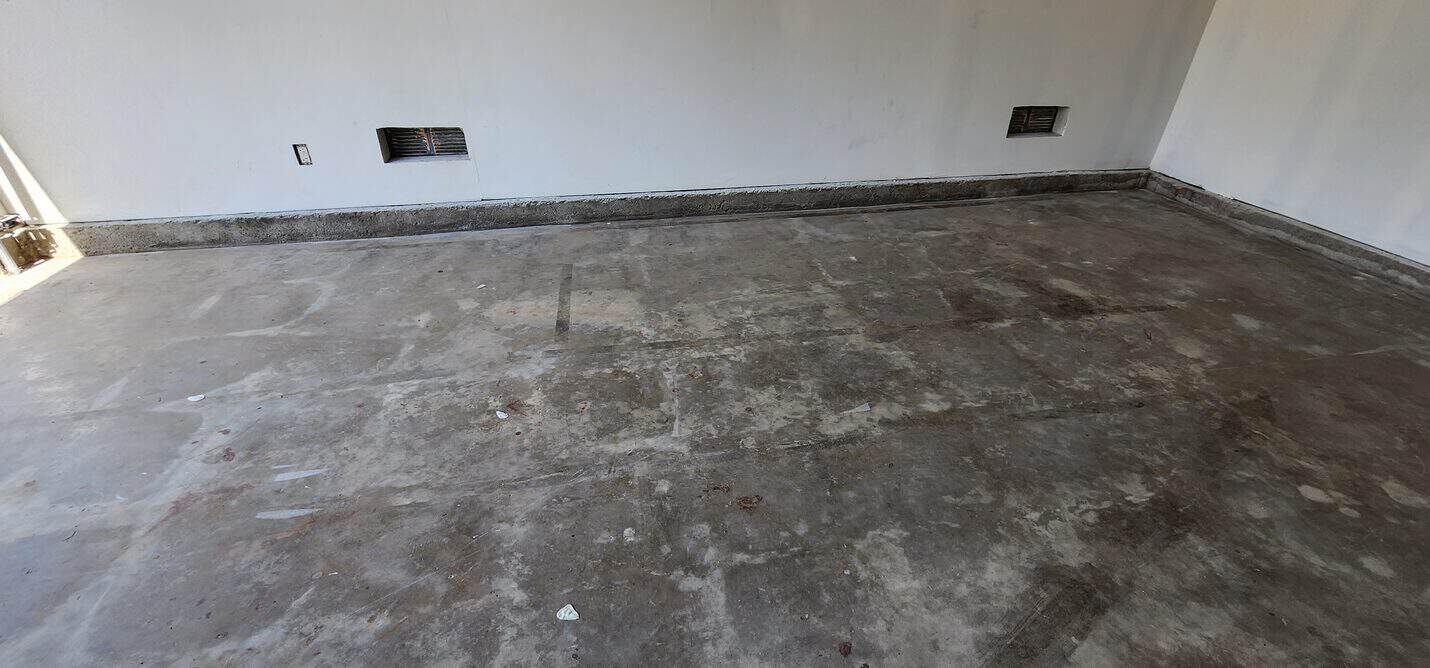 Bare garage slab prepared for the flake system