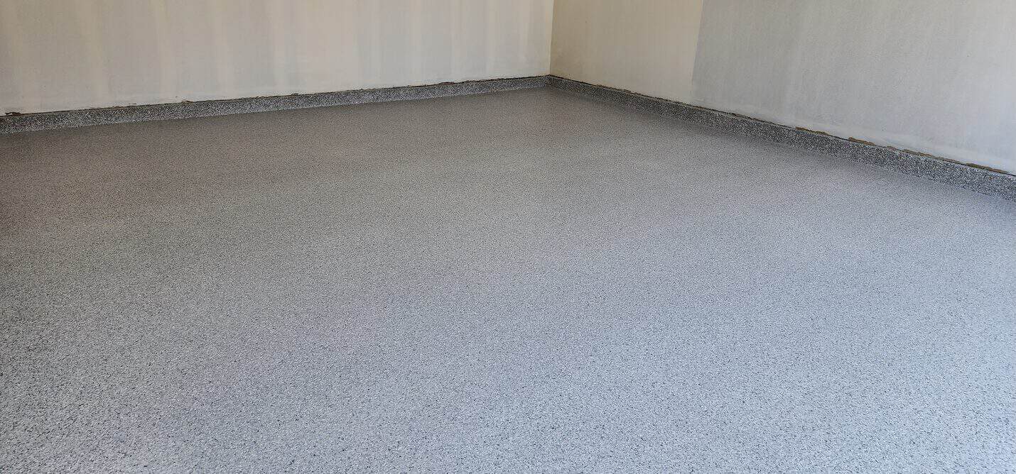 Flake epoxy floor with a coved base at the wall