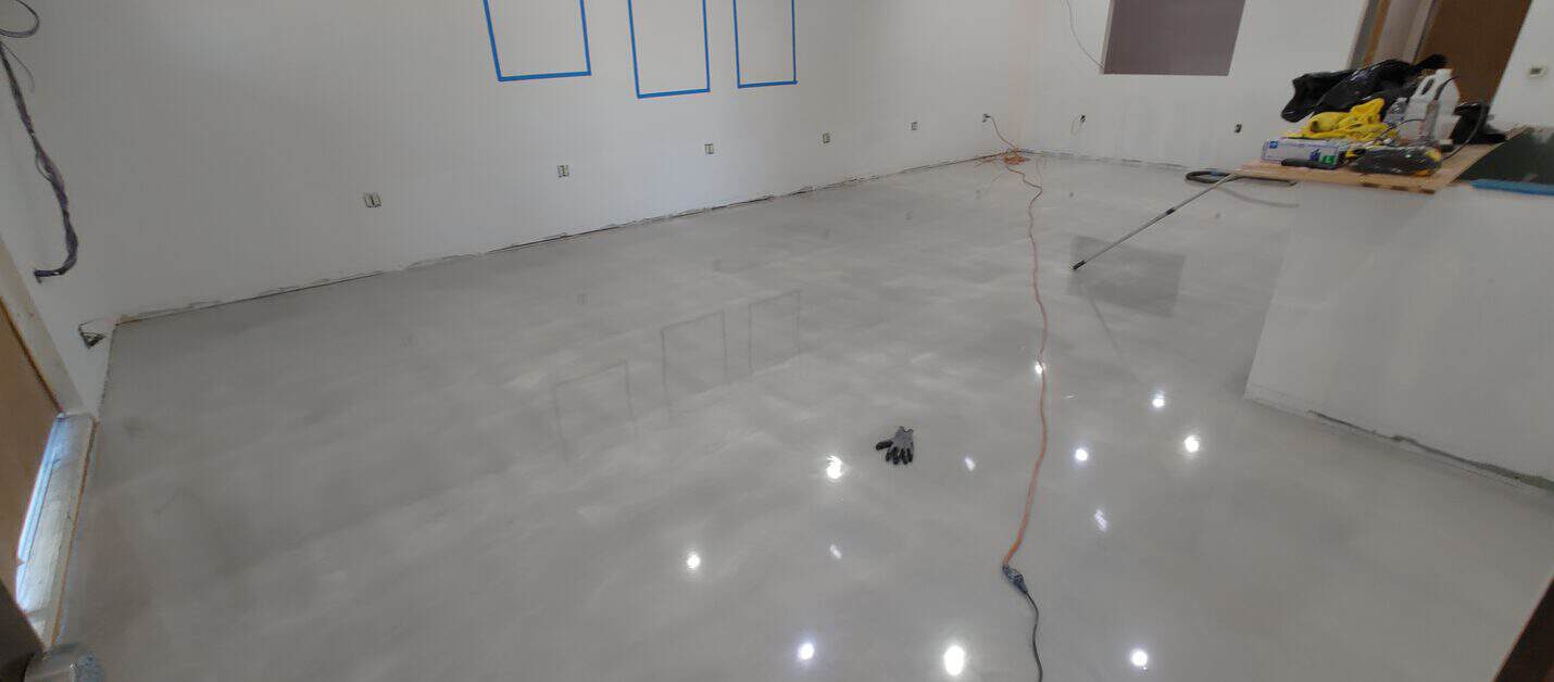 High gloss metallic salon floor reflecting the ceiling