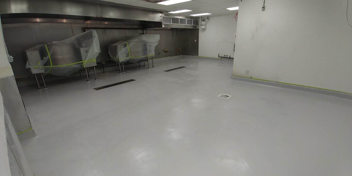 Light grey anti-slip epoxy floor in the finished production kitchen