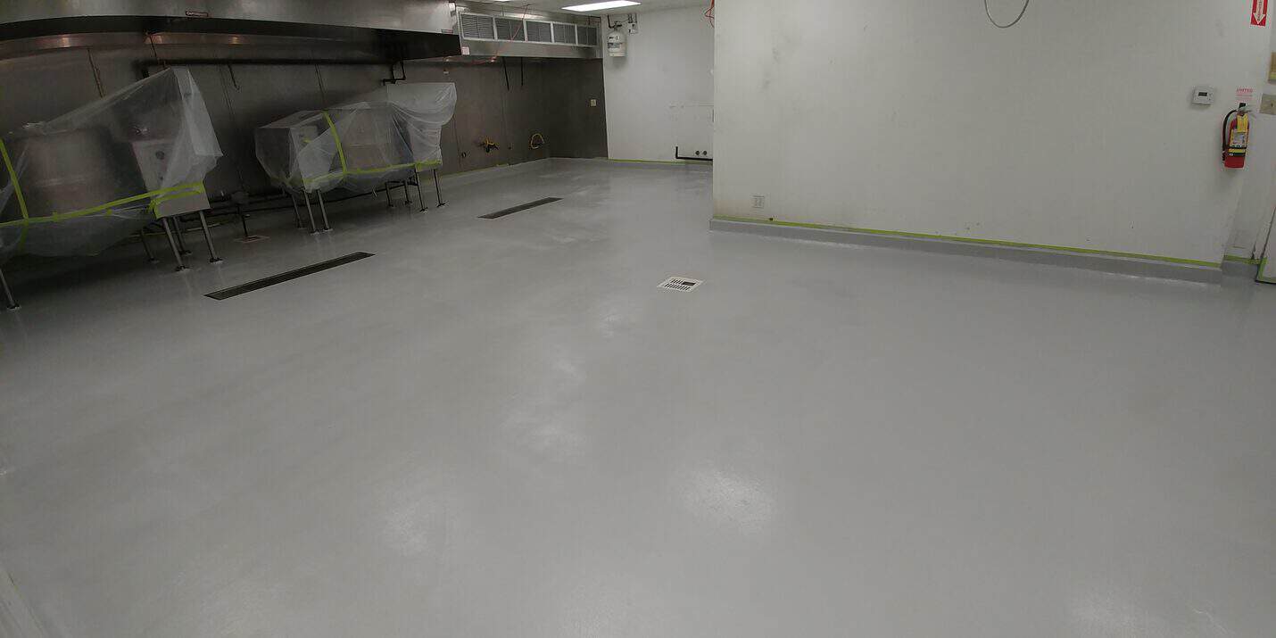 Coved epoxy base at the wall junction in the Gardena kitchen