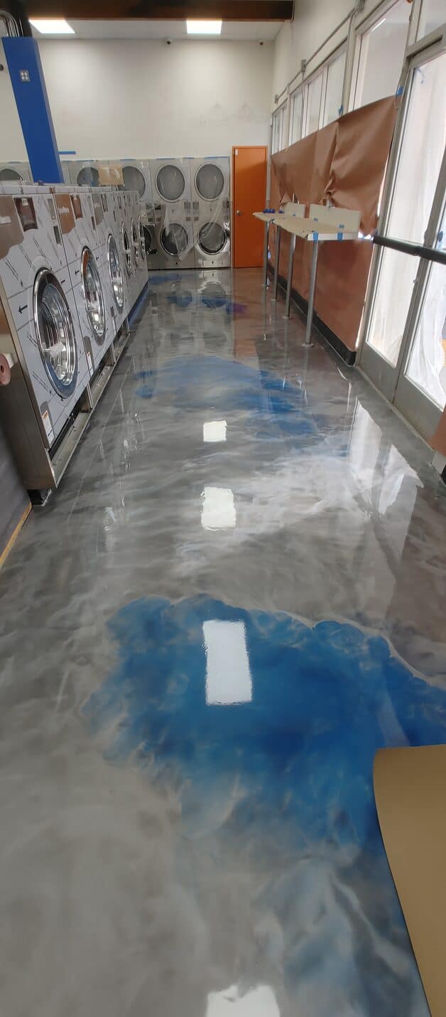 Finished metallic floor running down the machine aisle
