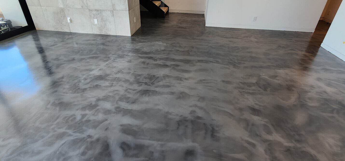 Metallic floor running to the full height glazing