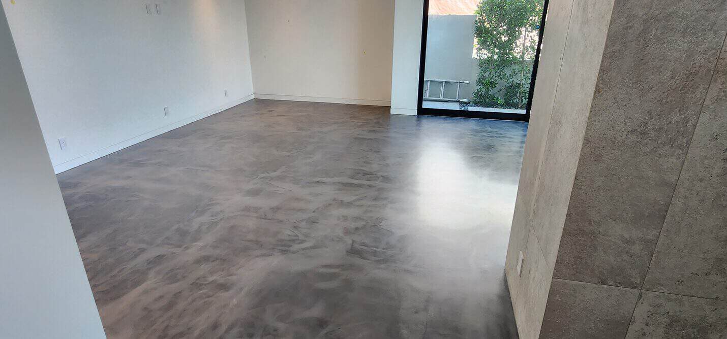 Matte metallic floor beside the stone clad column