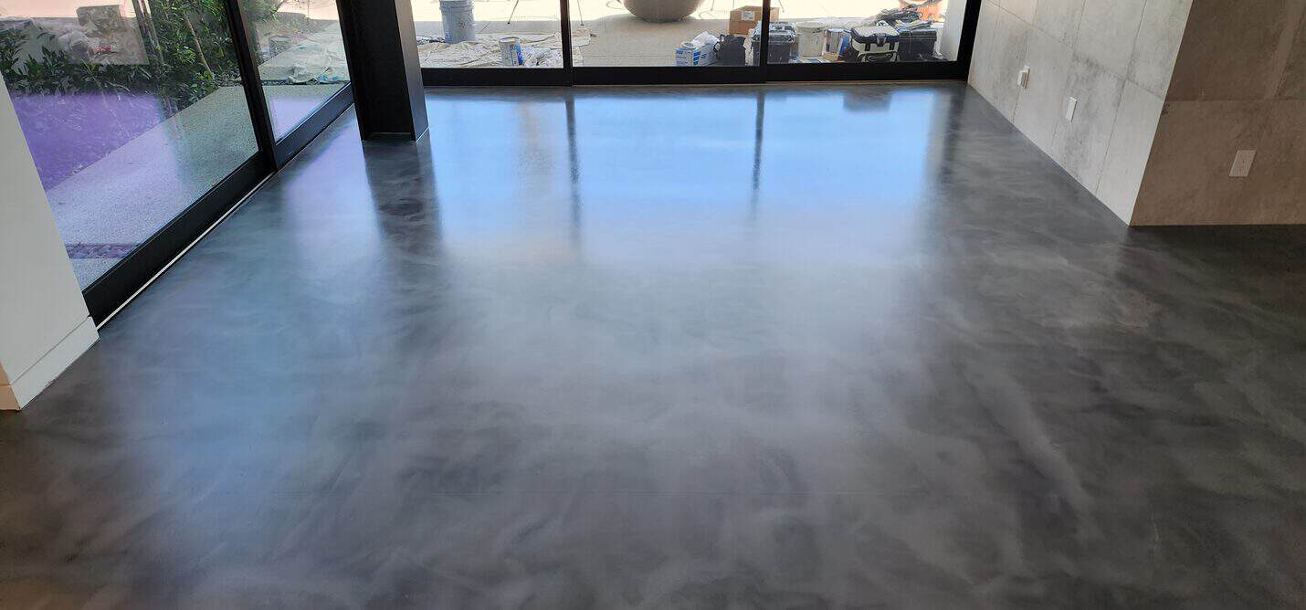 Finished matte metallic floor across the living space
