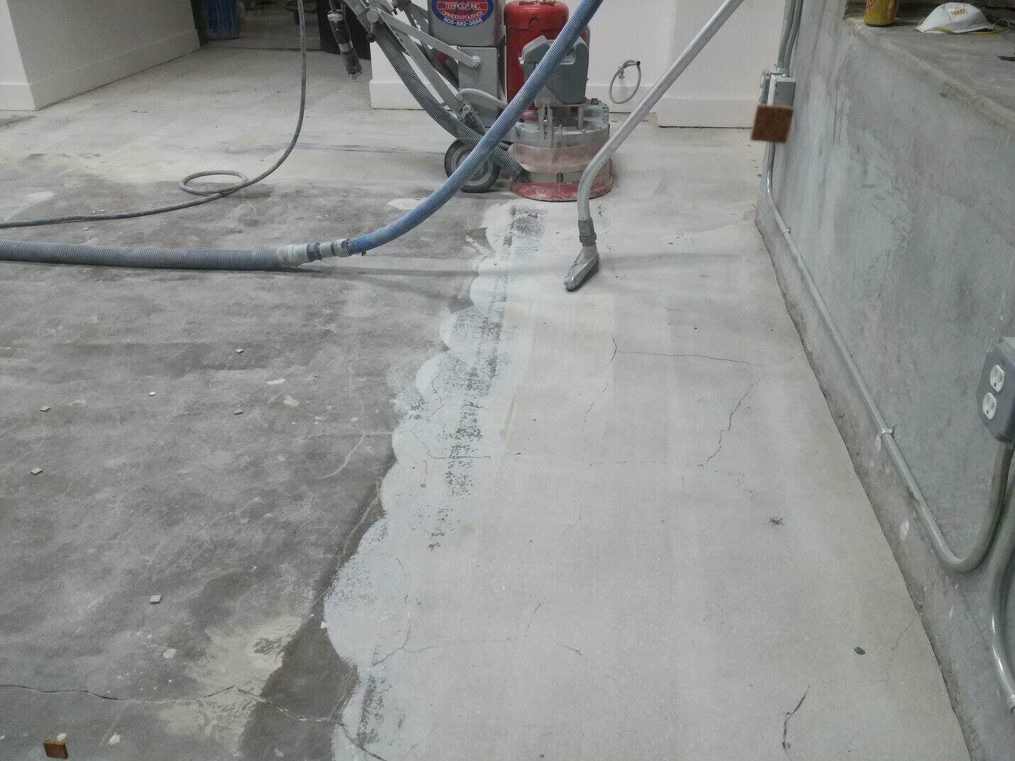 Adhesive residue across the bare office floor