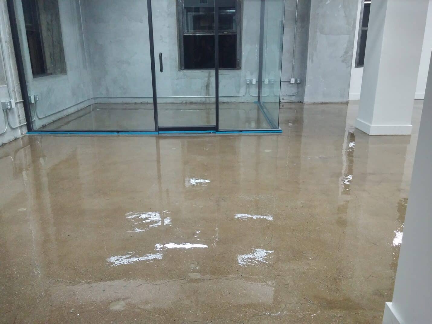 Finished clear epoxy office floor with the columns exposed