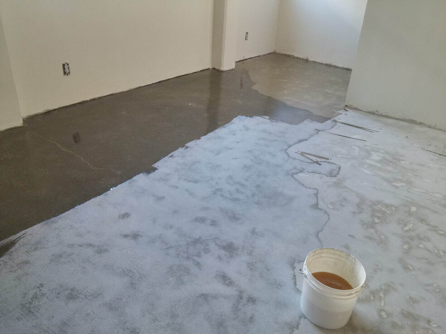 Grinding the office slab back to clean concrete