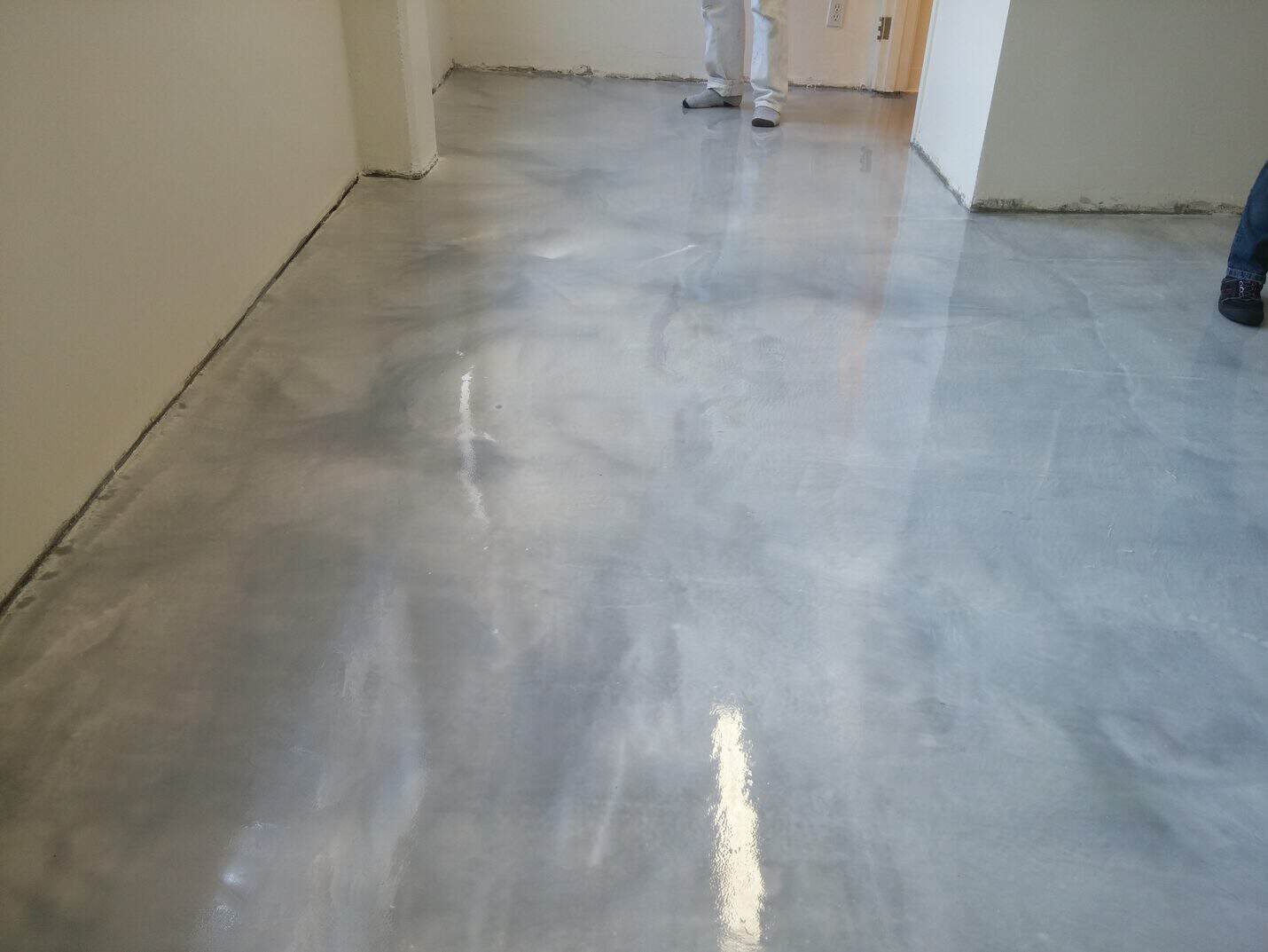 Metallic floor carried through into the restroom