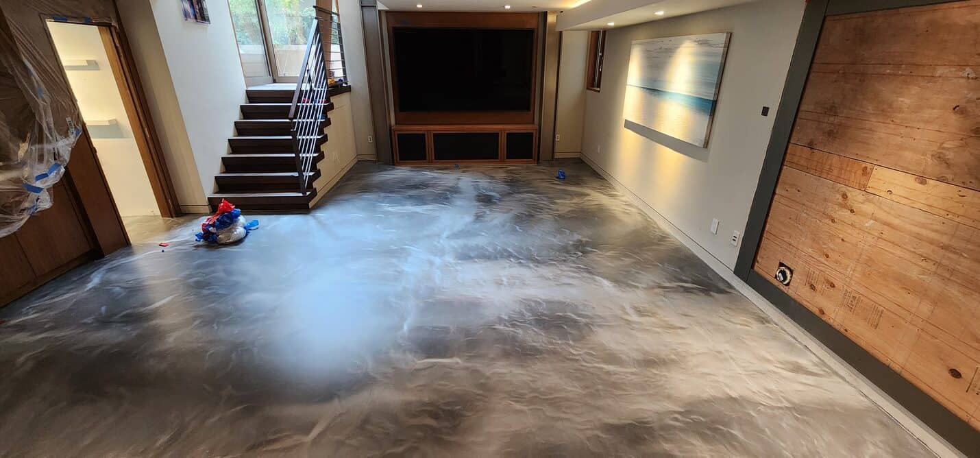 Warm metallic floor beside the wood clad feature wall