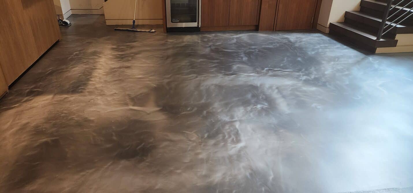 Finished bronze metallic floor across the living area