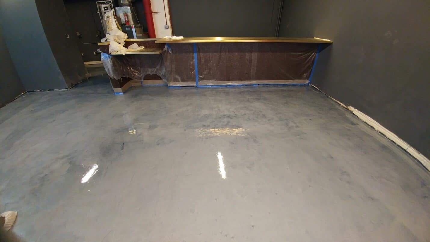 Finished floor running tight to the base of the bar