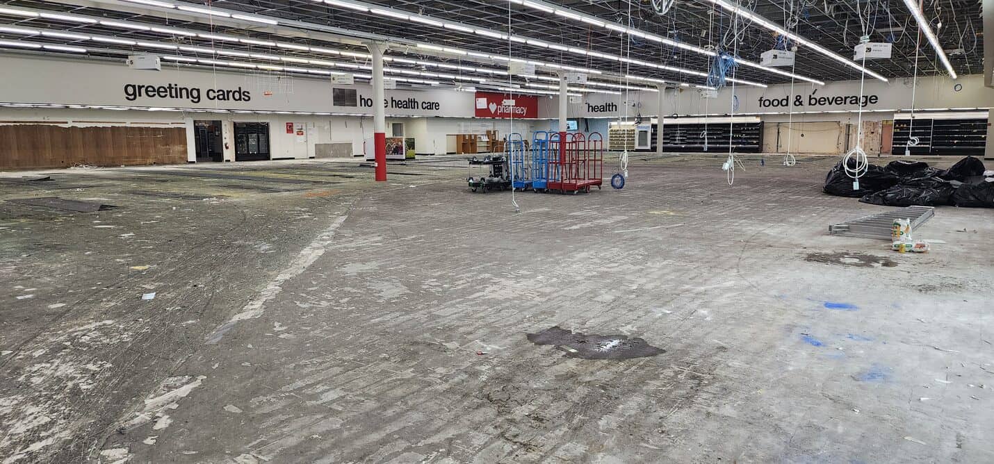 Floor tear-out in progress with aisle signage still in place, CVS Pacific Palisades (2 of 10)