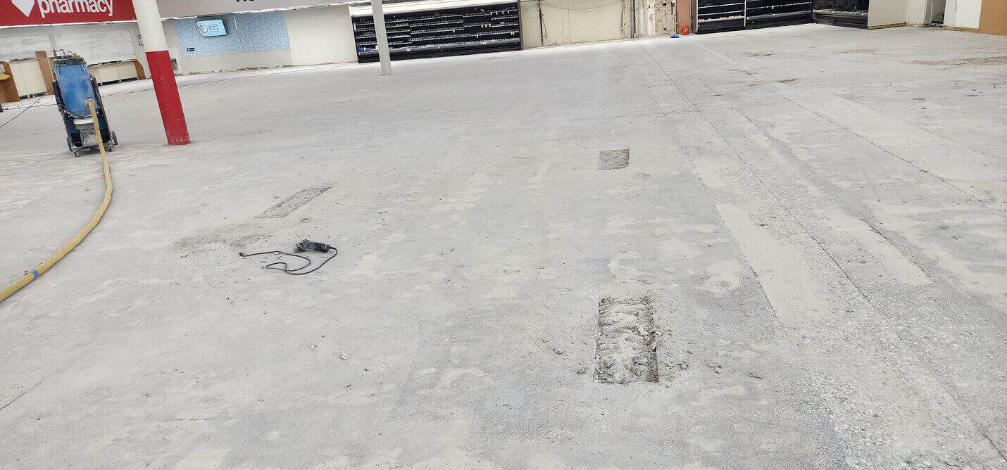 Bare slab showing patch repairs before polishing, CVS Pacific Palisades (4 of 10)