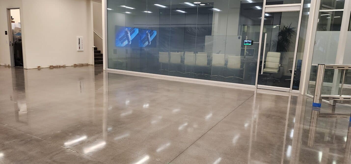 Polished concrete running past glass meeting rooms, VAST Aerospace Long Beach (7 of 10)